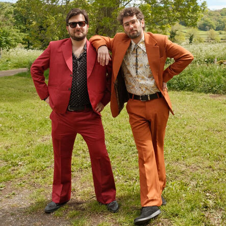 The Gastric Band in red and orange flared suits